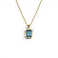 14K Emerald Cut London Blue Topaz Vertical Bezel Setting Pendant by Orlina Fine