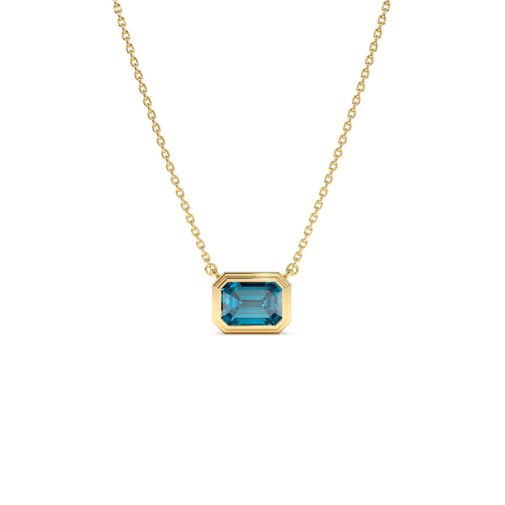 14K Gold 1.25 ctw Emerald Cut Bezel Setting Blue Topaz by Orlina Fine