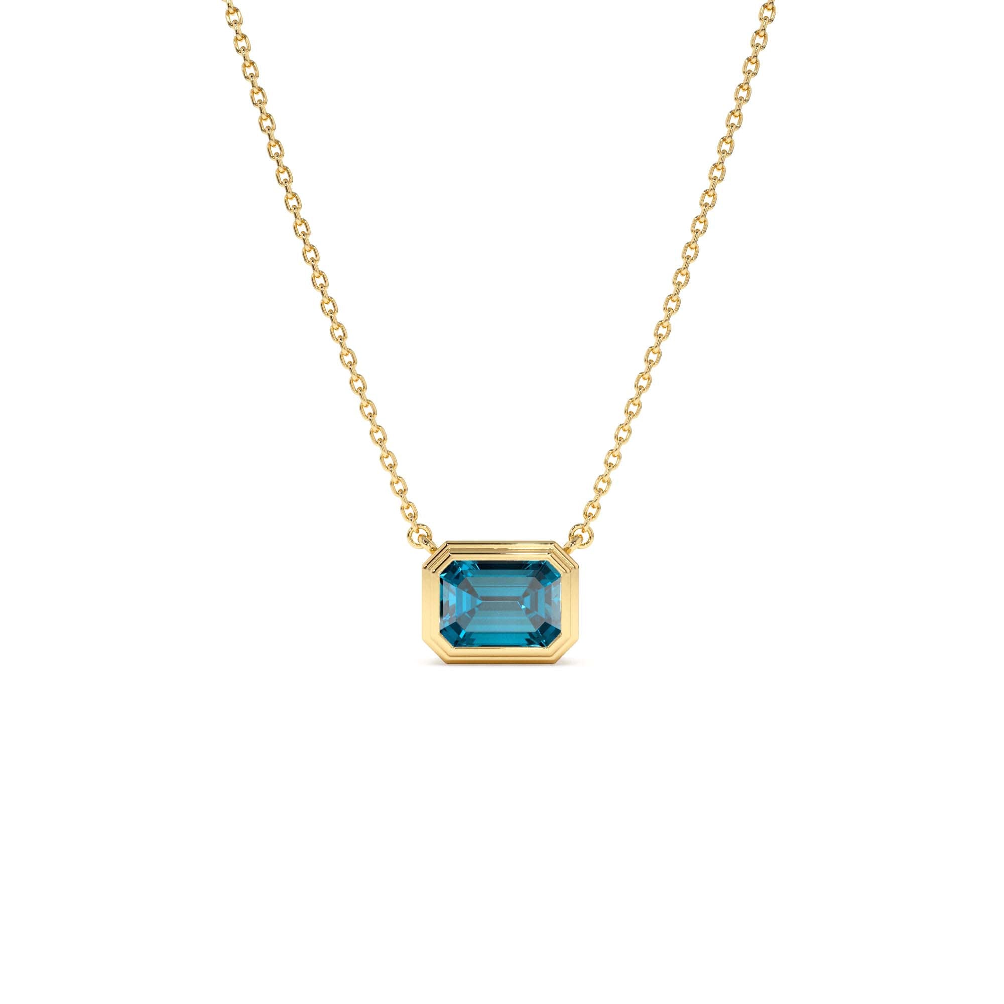 14K Gold 1.25 ctw Emerald Cut Bezel Setting Blue Topaz by Orlina Fine