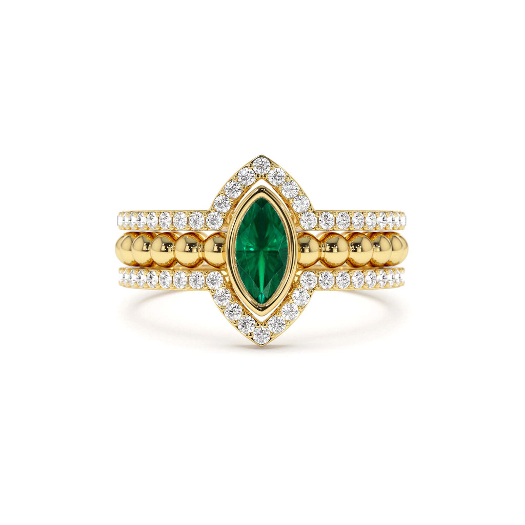 14k Marquise Shaped Emerald Ring with Nesting Diamond Bands by Orlina Fine