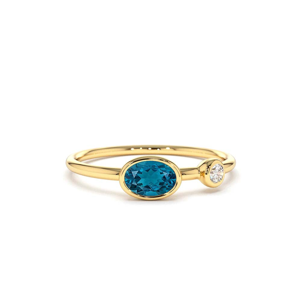 14K Gold Oval London Blue Topaz and Diamond Ring by Orlina Fine